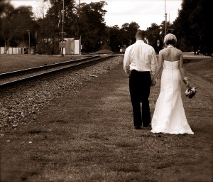 bride and groom walking holding hands